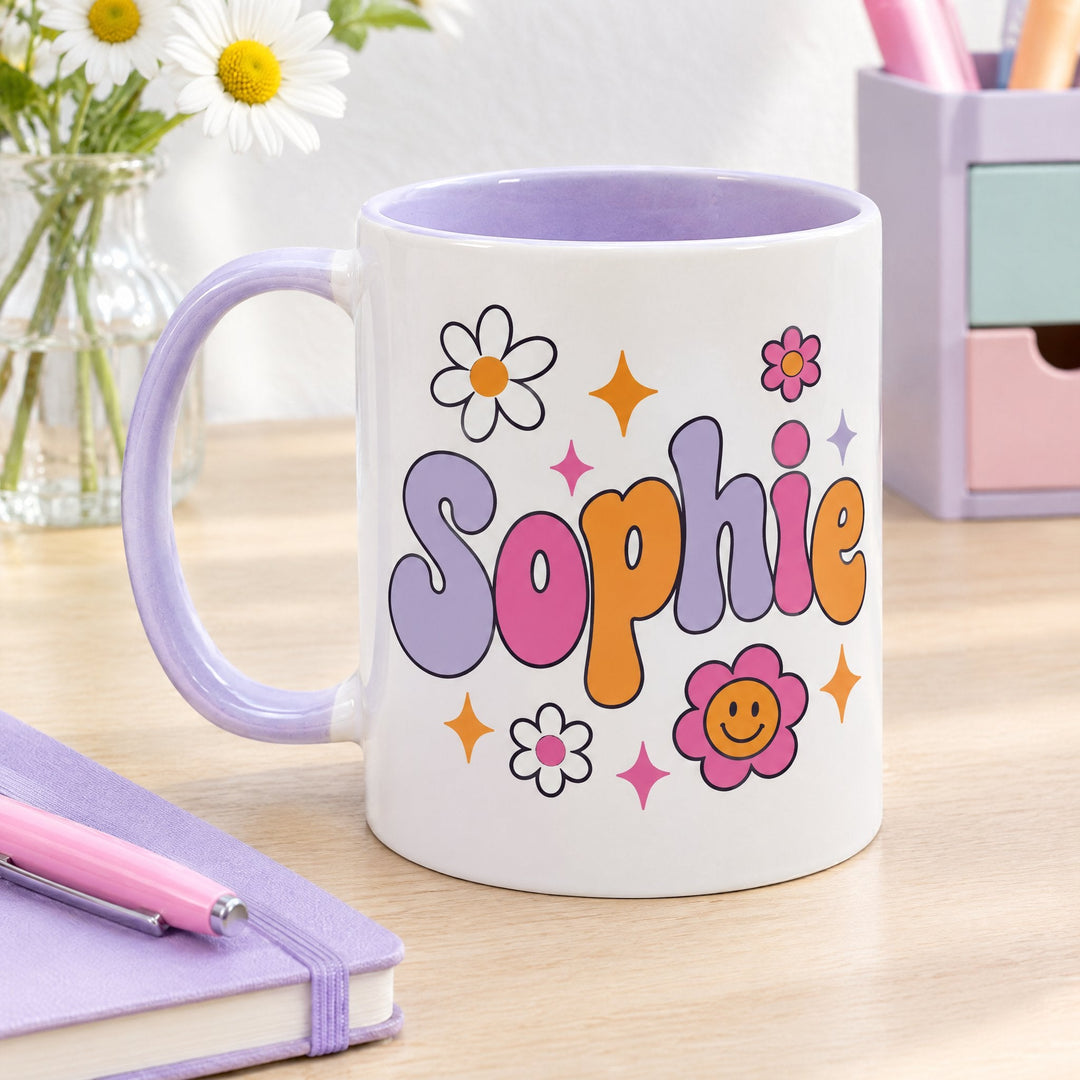 11oz lilac inner &amp; handle sublimation mug x36 printed with retro daisies and the name Sophie, on a wooden desk by a notebook