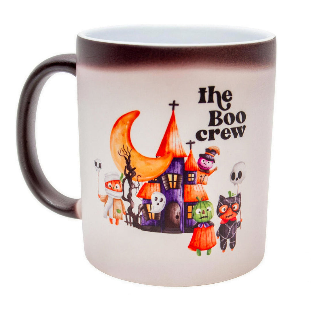 11oz matte black colour changing mugs, part-changed to white, showing a &