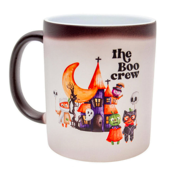 11oz matte black colour changing mugs, part-changed to white, showing a &