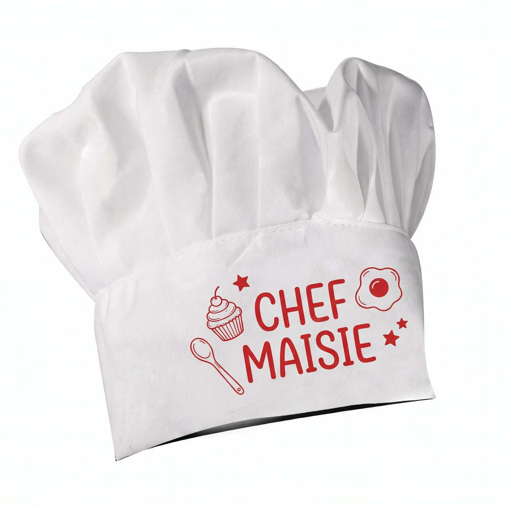 Child's chef hat printed with an illustrated cupcake, wooden spoon and fried egg design and the words 'Chef Maisie'