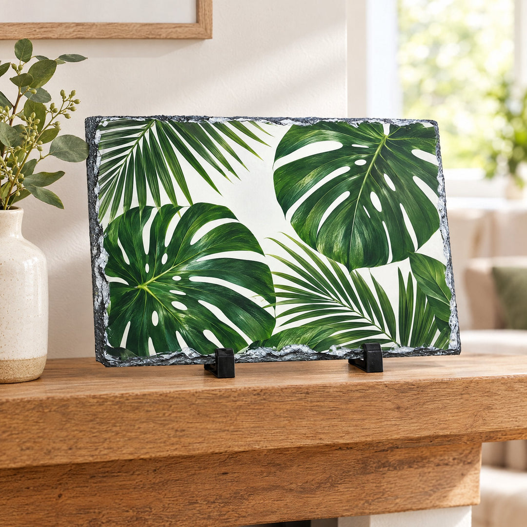 Photo slate rectangle 14cm x 19cm printed with palm and monstera leaves, on a wooden mantelpiece