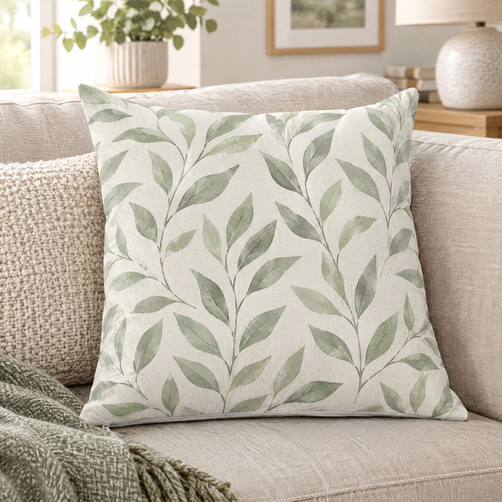 Sublimation cushion covers printed with soft sage-green leaves, on a linen sofa